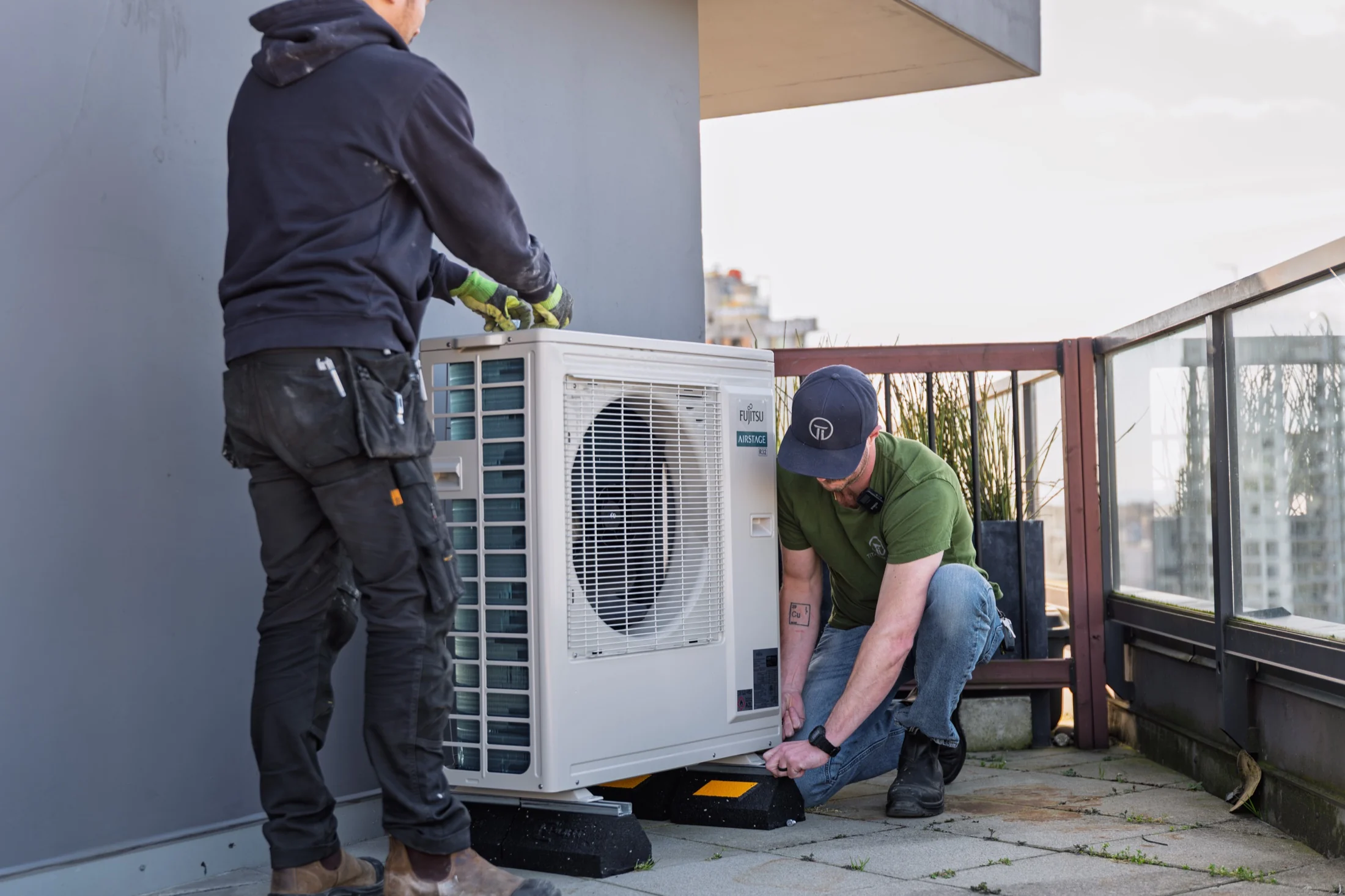 Titanium HVAC crew installing a heat pump
